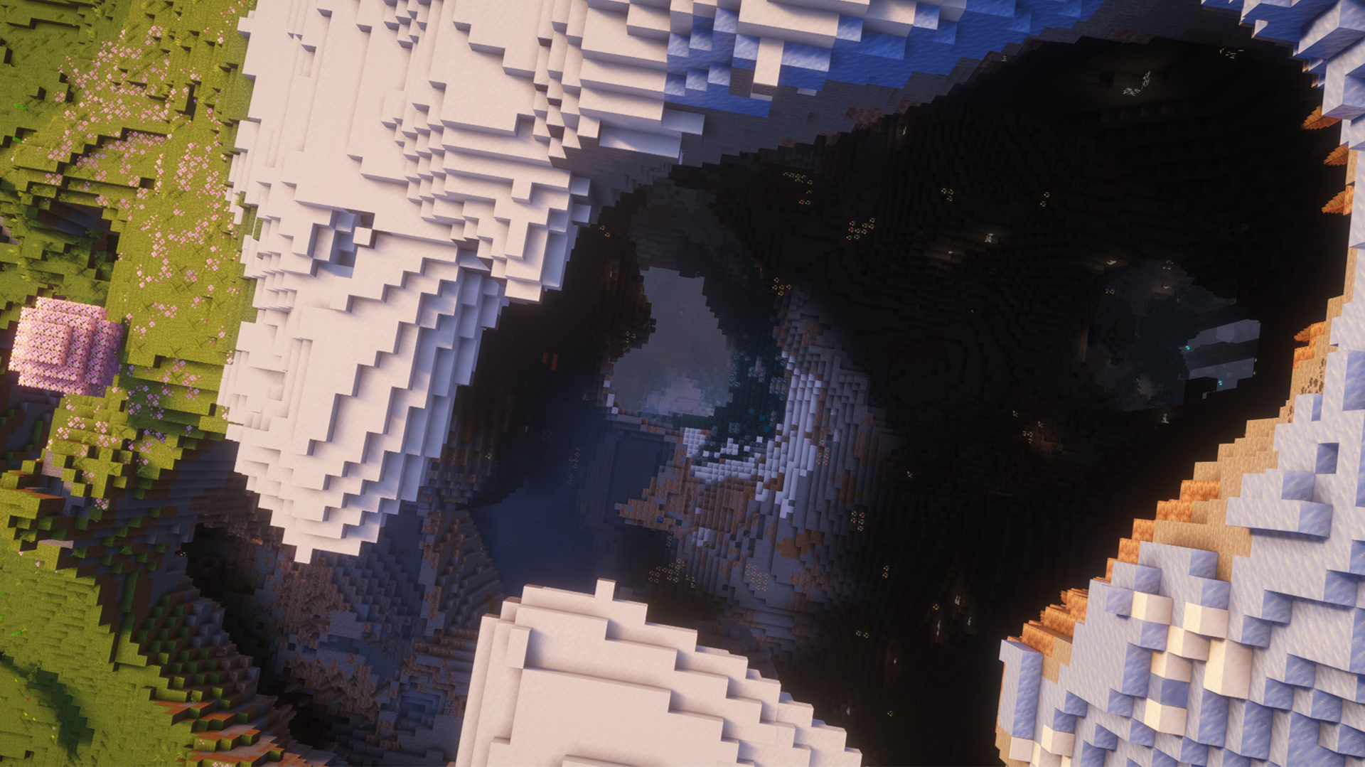image of a Minecraft seed with a hollow frozen peaks mountain with deep dripstone cave