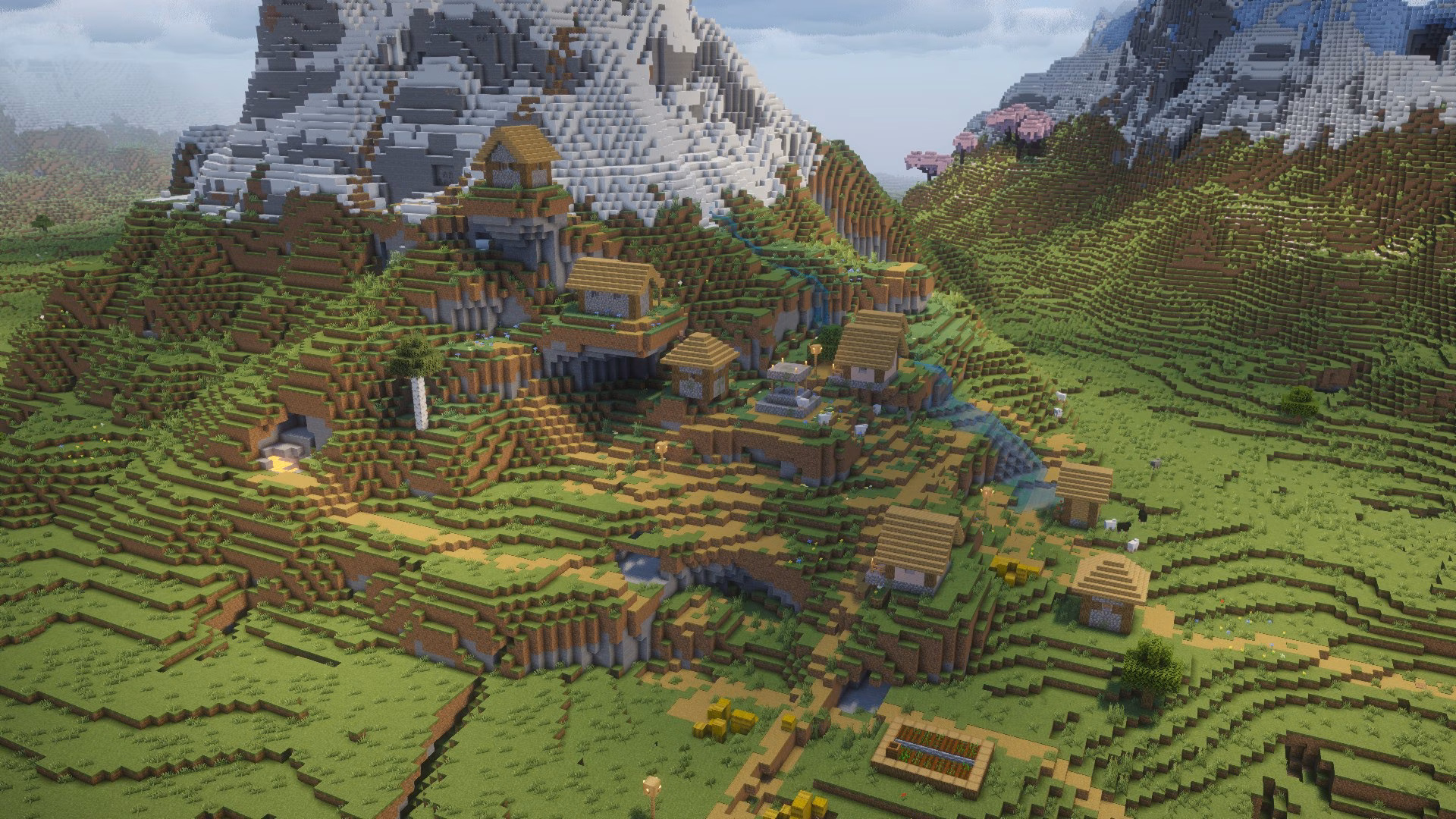 A minecraft seed with a cherry grove village in a snowy mountain